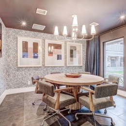 a well-lit dining area with a table