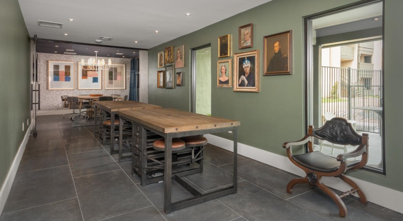 room with long work benches and stools