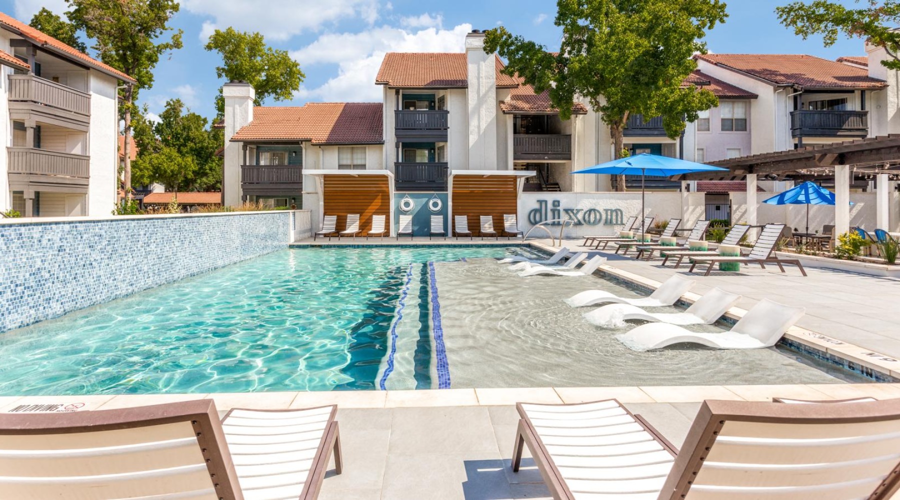 a swimming pool with water feature