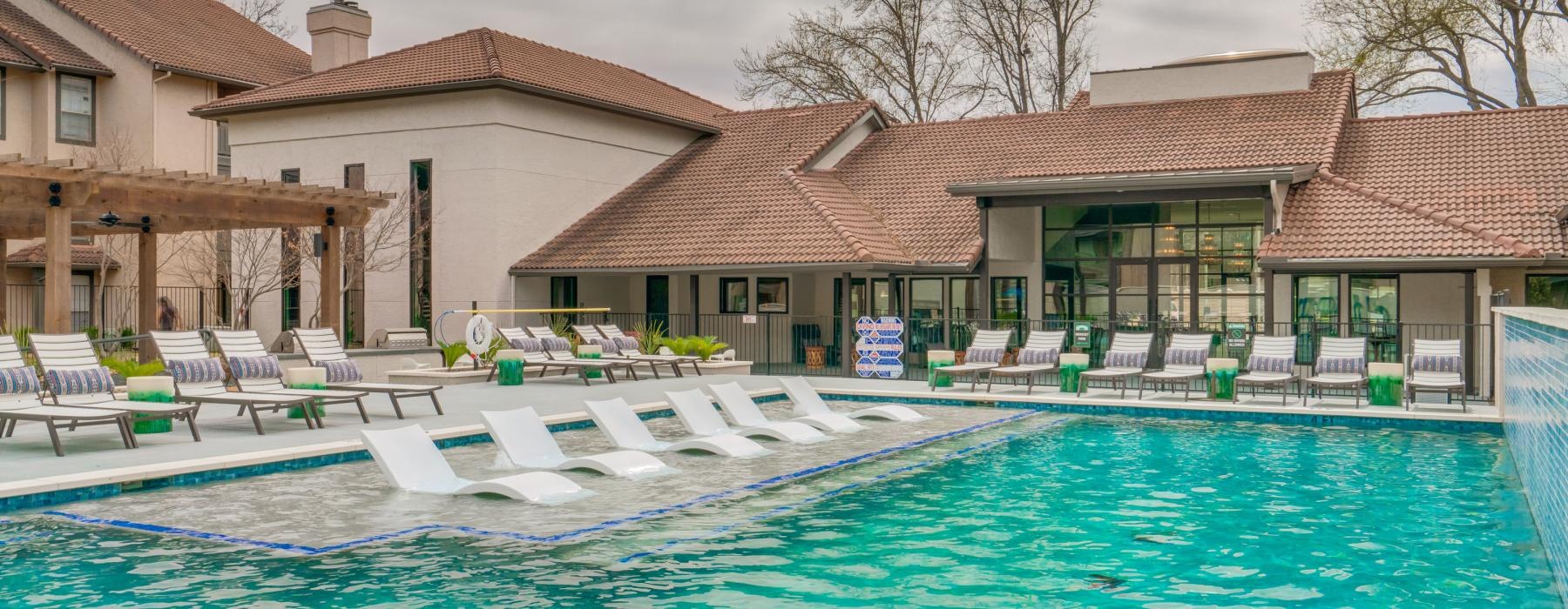 a pool with chairs around it