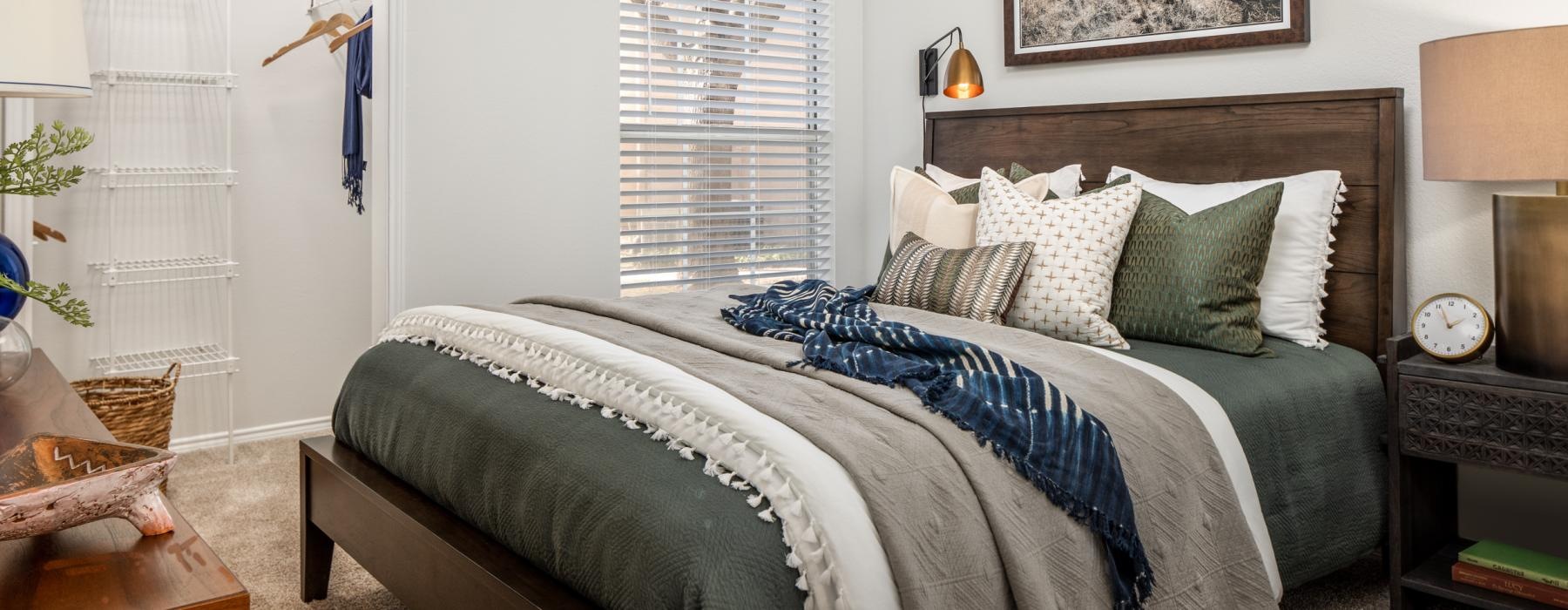 carpeted bedroom with walk-in closet