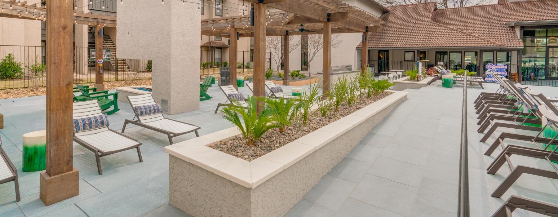 pergola covered lounge chairs