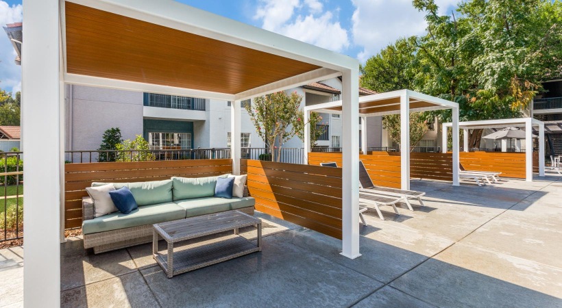 poolside cabanas with couch and table